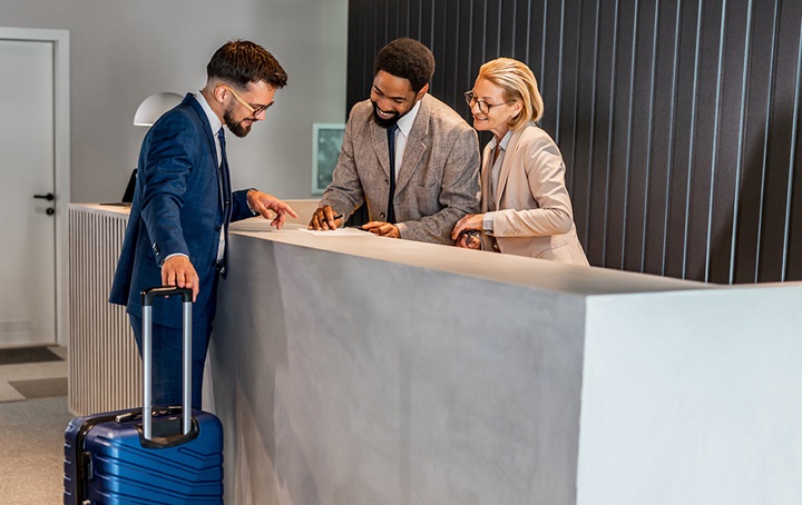 Image of guest checking into a hotel