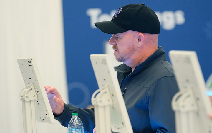 Image of person using a kiosk