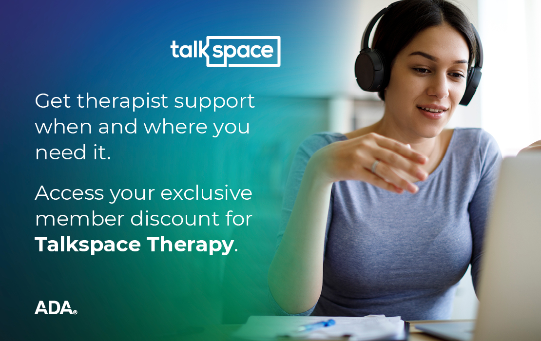 Talkspace - Woman with headphones on computer.