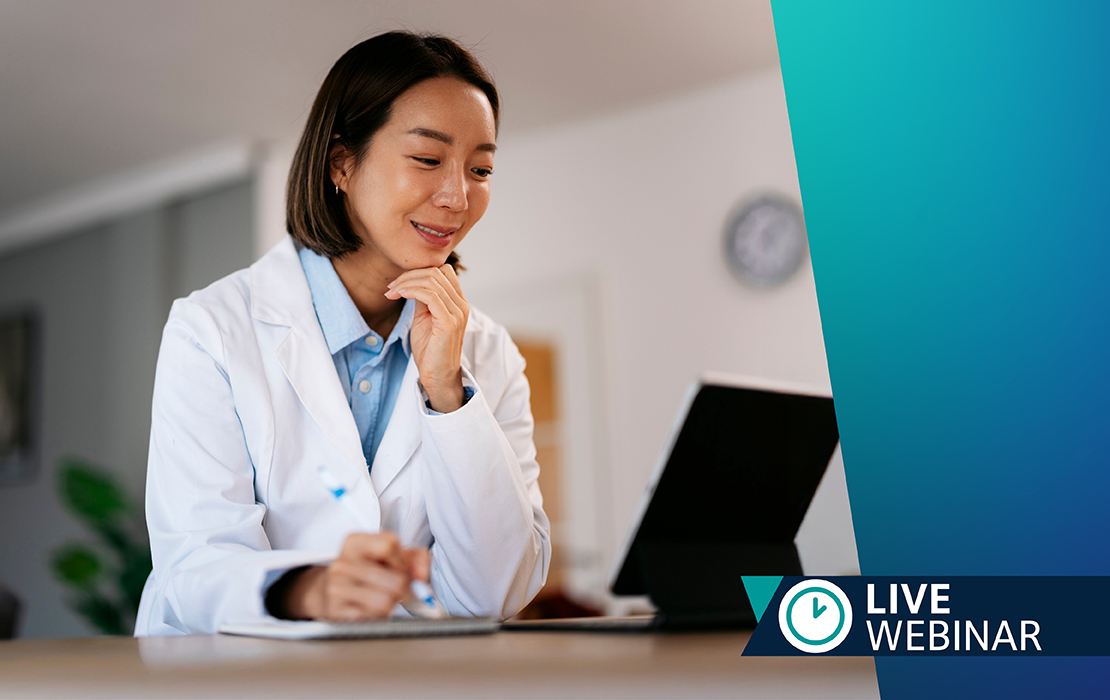 Dentist looking at laptop — Live Webinar