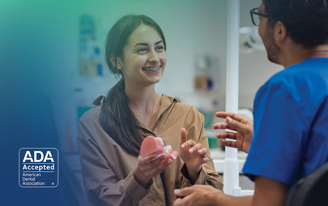 Hygienist talking to a young patient