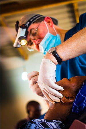 Dentist examining patient