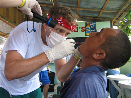 Dentist giving patient shot in mouth