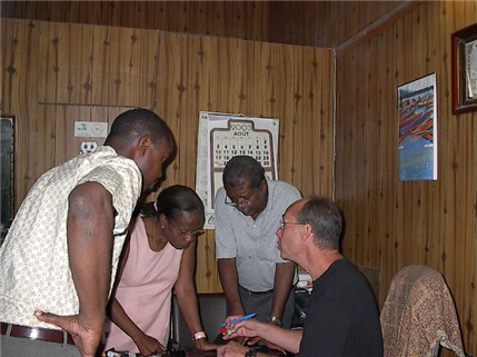 4 people discussing something in dental office