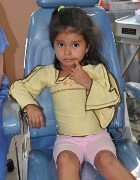 Young girl in dental chair