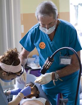 two clinicians treating young patient