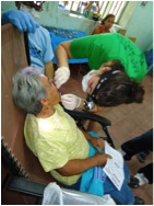 dentist treating older man