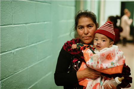 Mother with babay post surgery