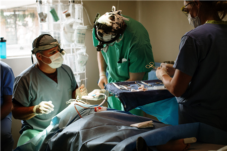 Surgeons treating child