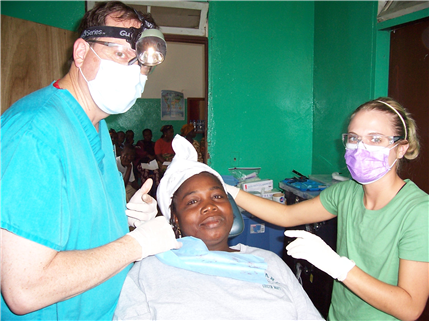 dentist and assistant with patient in chair