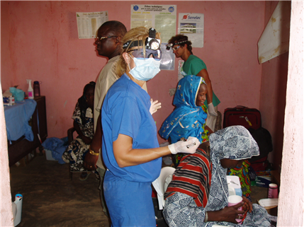 Volunteer dentist in clinic