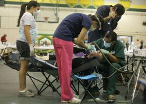 Patient being treated at outdoor clinic