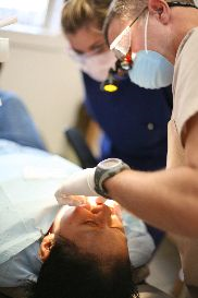 Dentist treating patient